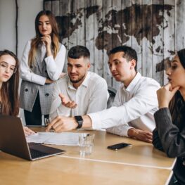 Group of people working out business plan in an office